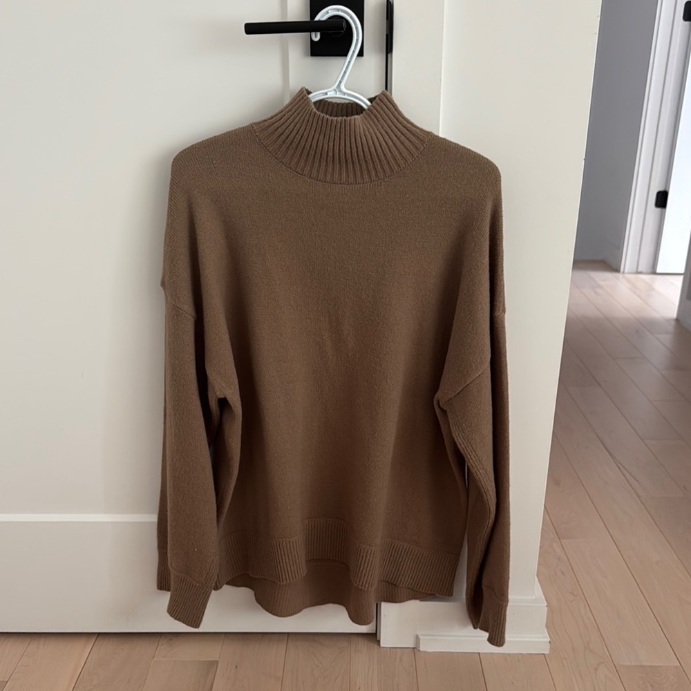 Oversized turtleneck beige sweater